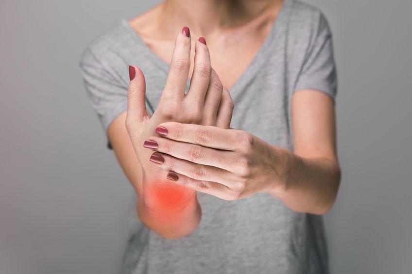 Elderly woman suffering arthritis in her wrist