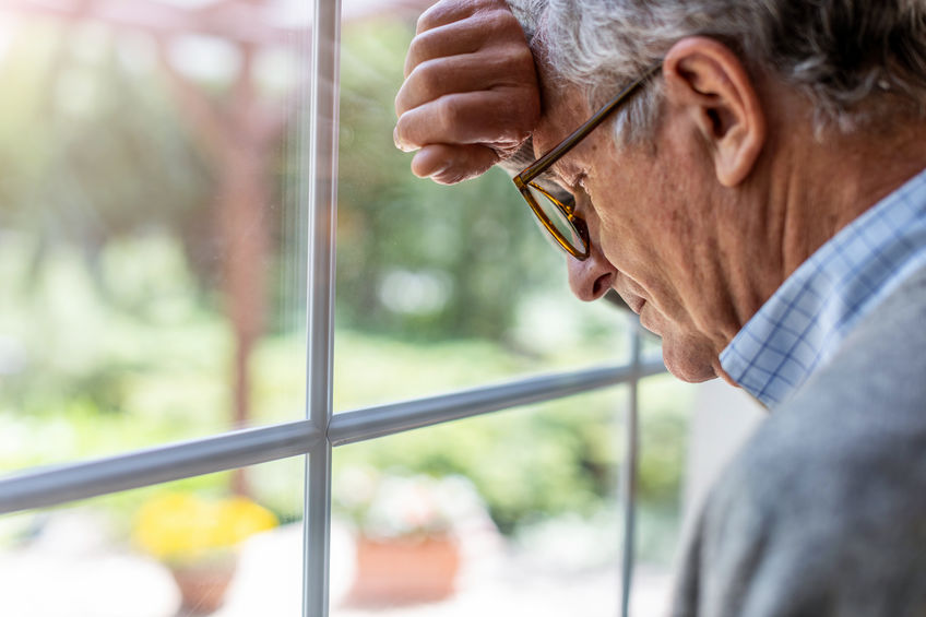 Man with dementia staring out the window