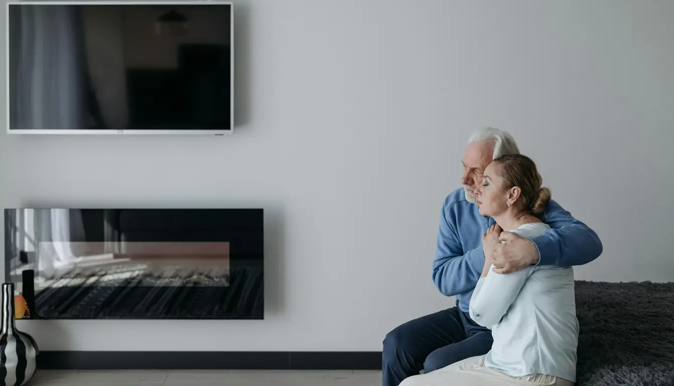 A father embracing his daughter with concern